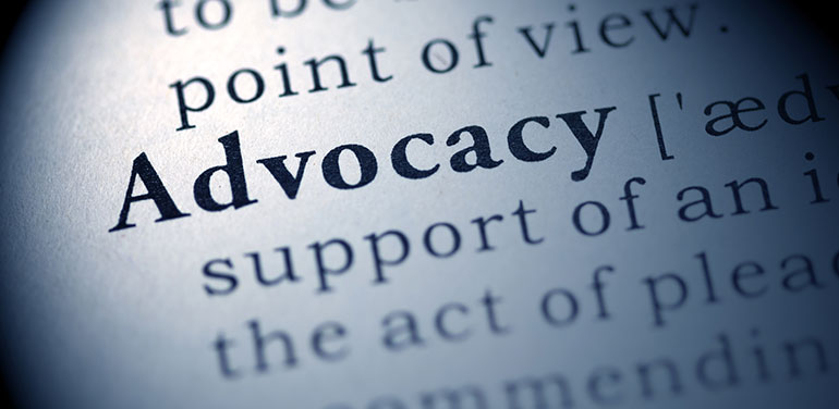 close up of dictionary definition of advocacy