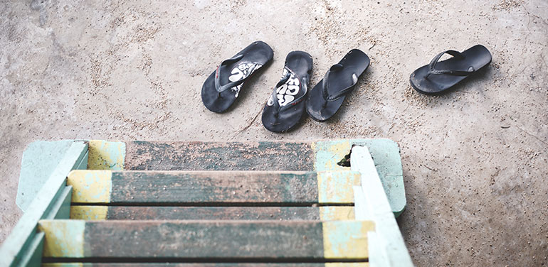 Pairs of thongs on the beach