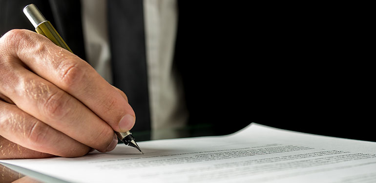 Man writing a legal document