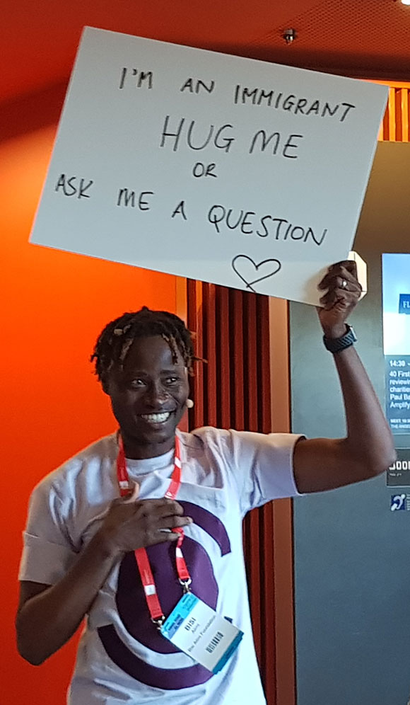 Bisi Alimi holding placard