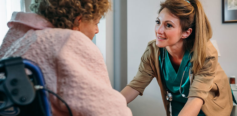 Disability support worker with lady in a wheelchair