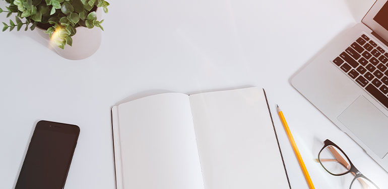 desk with blank notebook