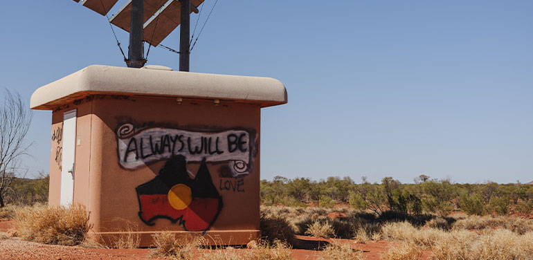 Always Will Be written above Indigenous flag