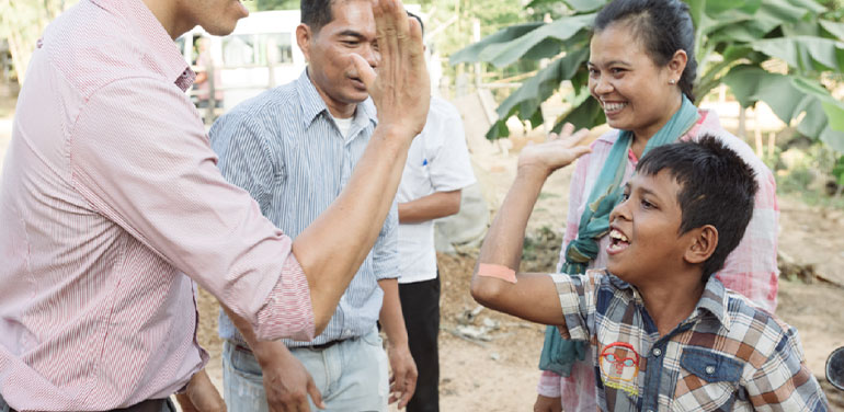 Ling high-fiving someone.