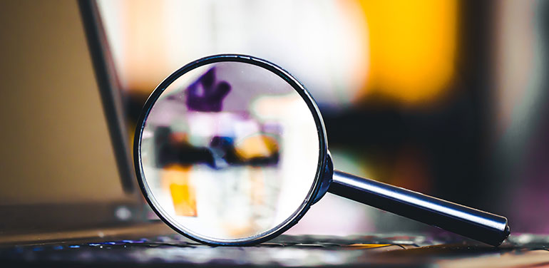 magnifying glass on a computer.