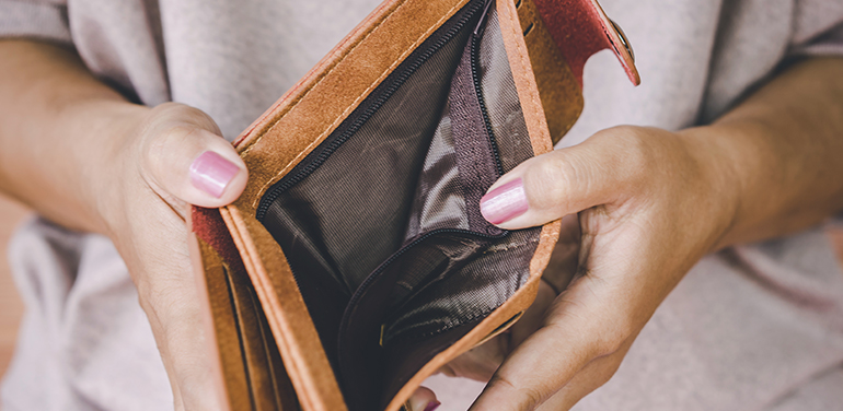 woman holding empty purse