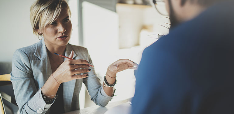 Woman interviewing man