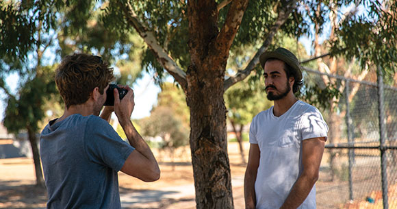 Darius interviewing participant for The Common Thread