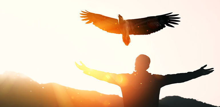 man outstretched arms with eagle