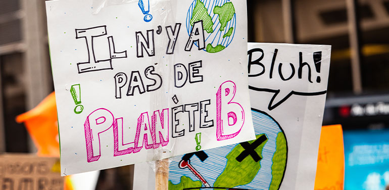 Sign at a climate march in Montreal.