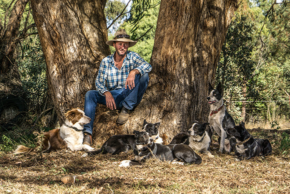 Bernie and dogs under a tree. Photo: Clayton Rose.