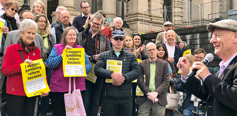 Tim Costello speaking on the steps of Parliament.