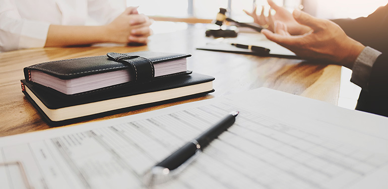 people discussing case over a table