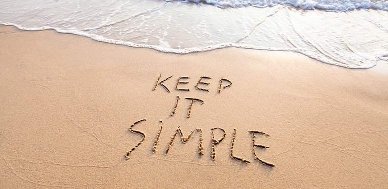 Keep it simple written in the sand on the beach