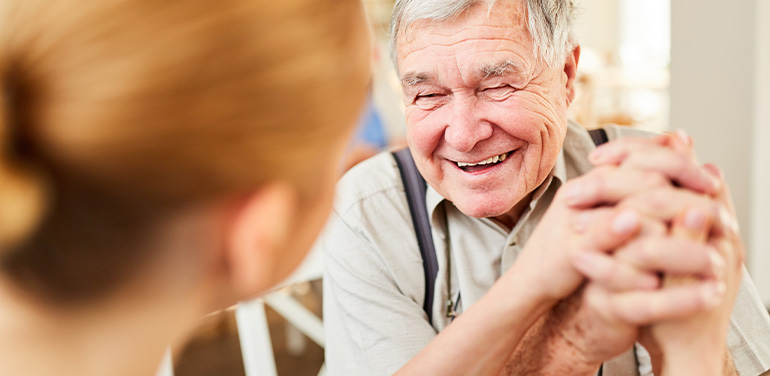 Man holding nurses hand