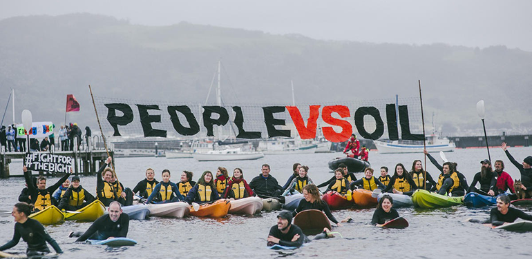 protesters on surfboards