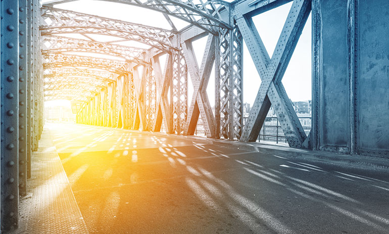 Sunlight shining through a bridge tunnel