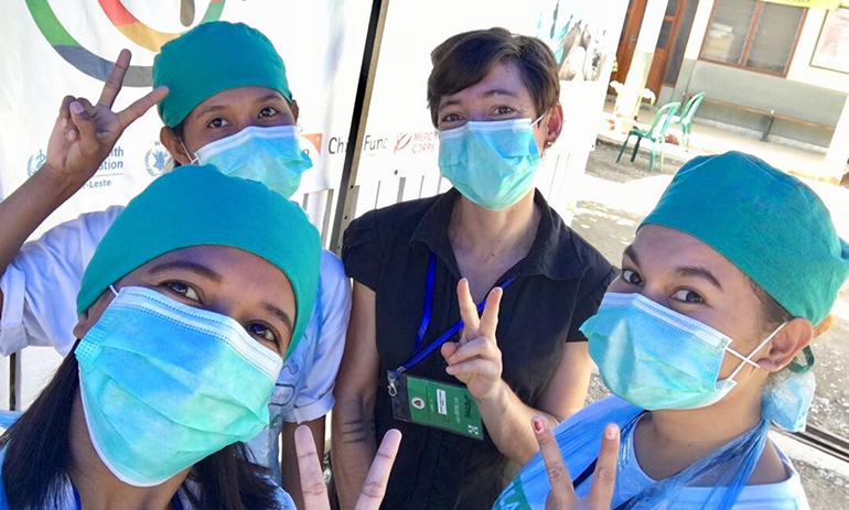 Four members of staff at Maluk Timor wearing face masks