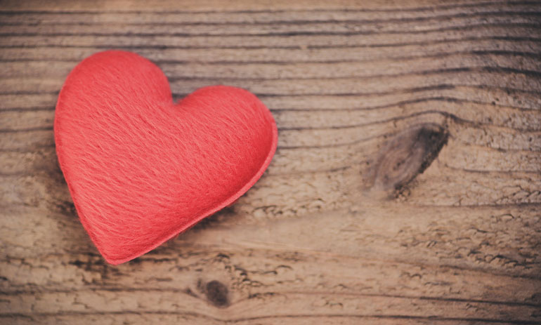 red heart on a wooden background