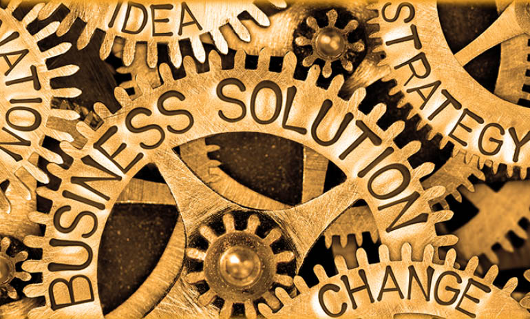 cogs with words on them including 'change' and 'business solution'