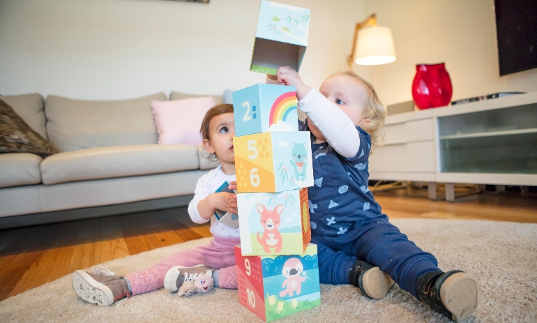 Children playing with nesting blocks