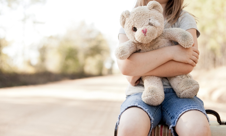 Young child with a teddy bear