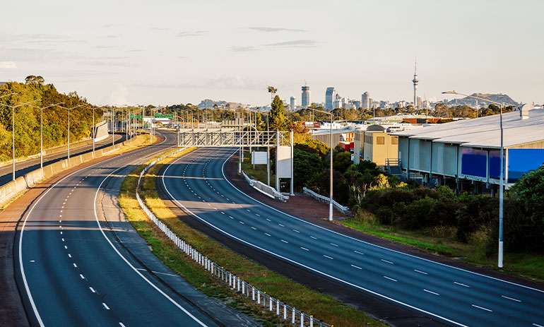 deserted motorway with the Auckland skyline in the background