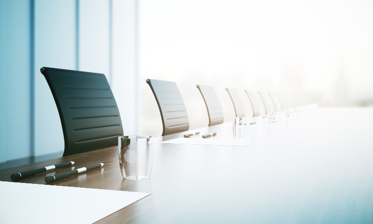 Close of up table with equipment in conference room.