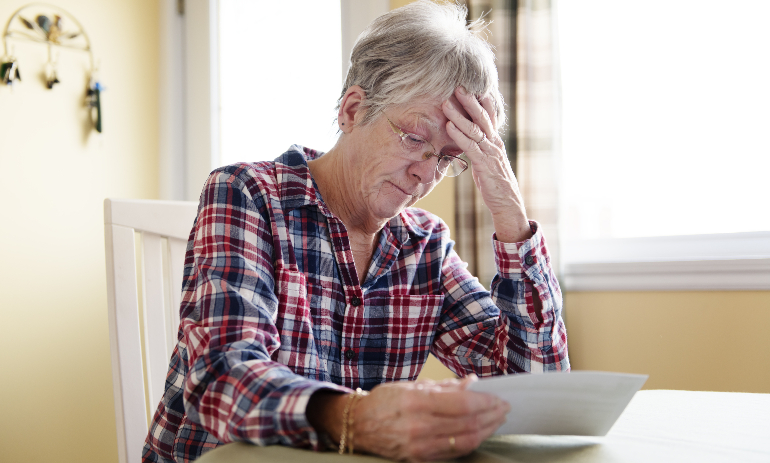 Older person stressed about bills