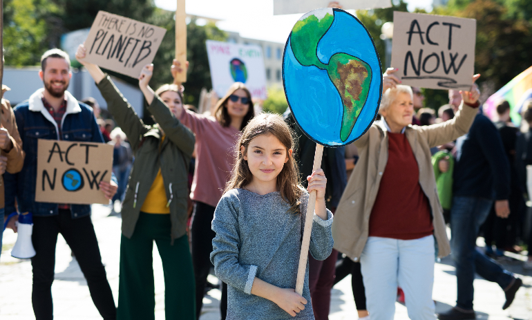 People with placards and posters on a global strike for climate change.