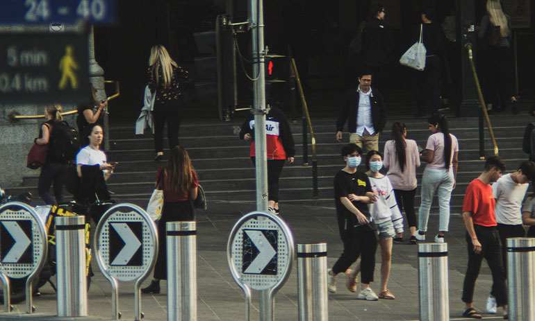 groups of people in Melbourne CBD wearing face maks