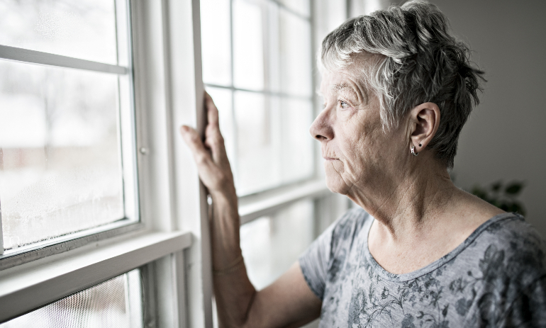 A sad and lonely 60 year old senior in an apartment