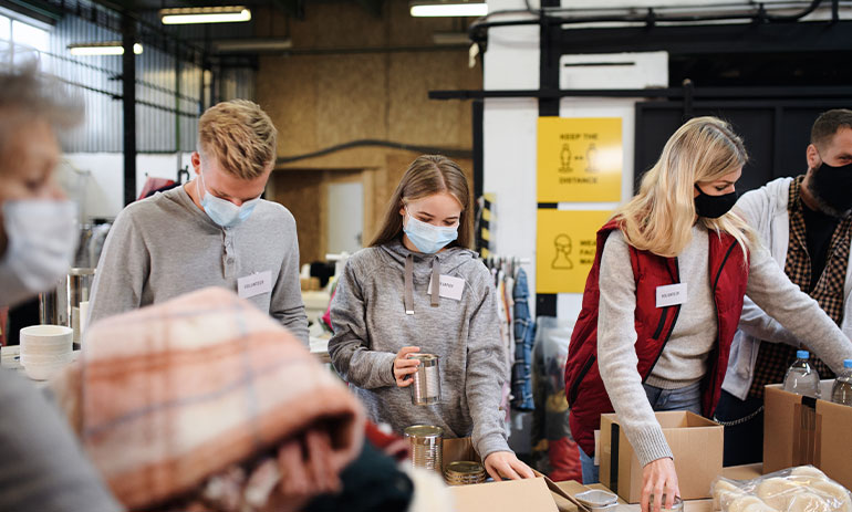 Charity workers sort through donations