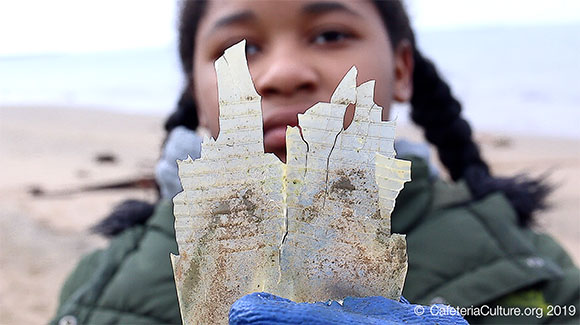 still from Microplastic Madness, girl holding piece of plastic