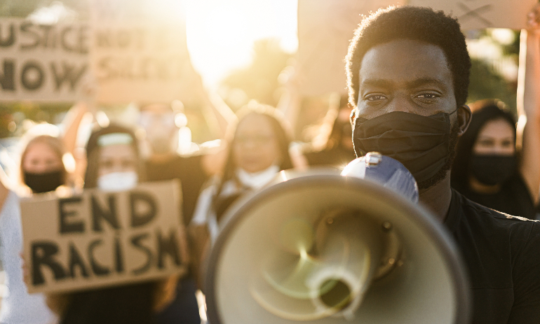 Person with megaphone at protest