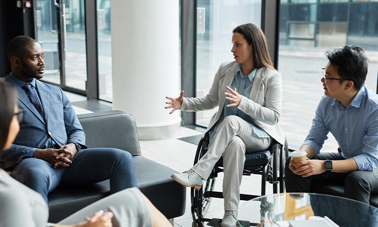 a group of people in suits in a discussion