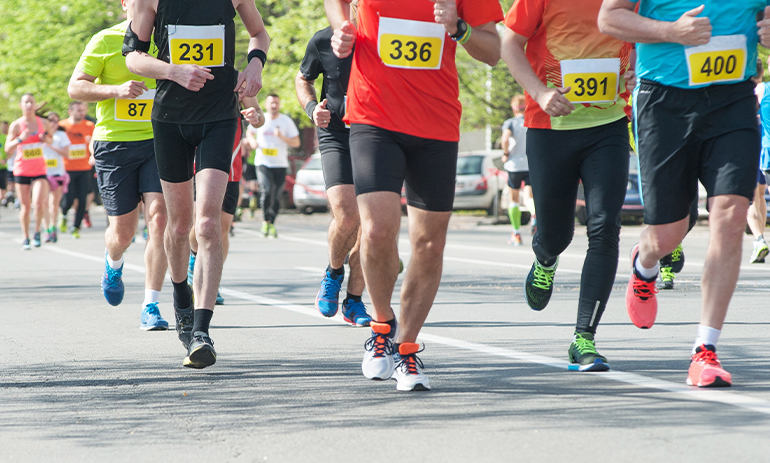 close up people running in a race