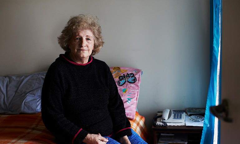 Woman sitting on a bed