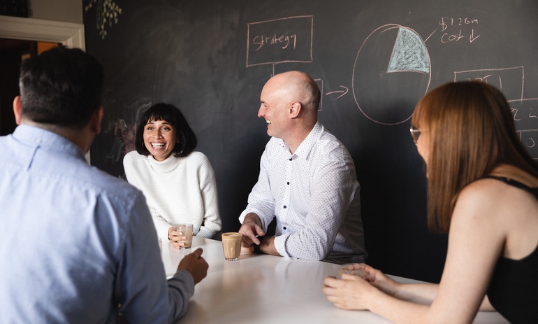 group of people sitting around a table