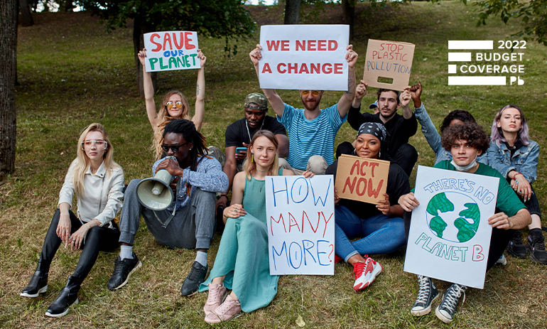 young people holding climate protest signs