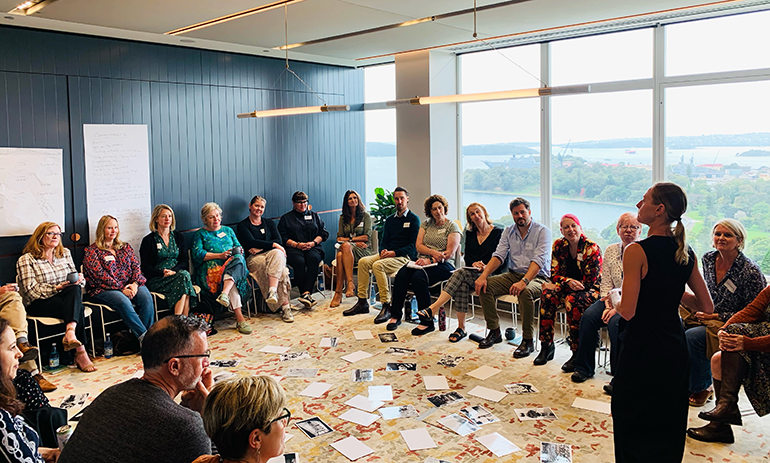 Group of people sitting on chairs in a circle