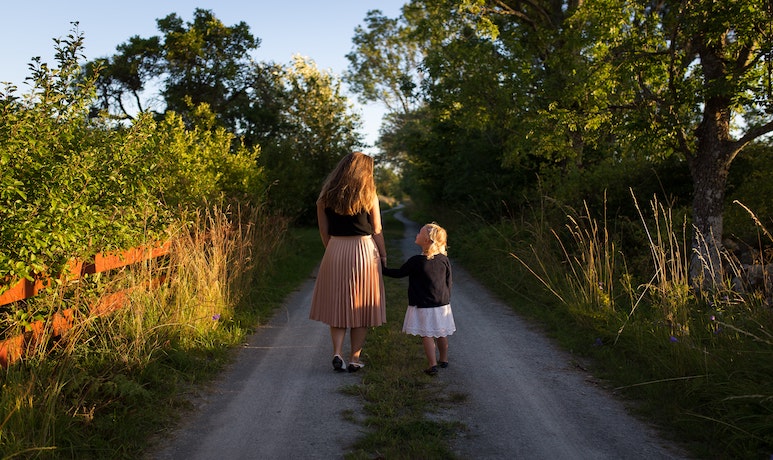 Woman walking with child