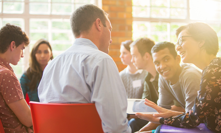 group of people sitting and talking