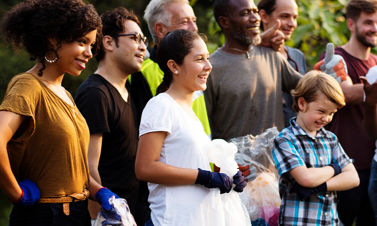 group of volunteers standing and smiling