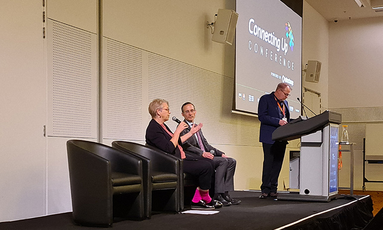 Janet Rice and Andrew Leigh address the audience, while David Crosbie moderates