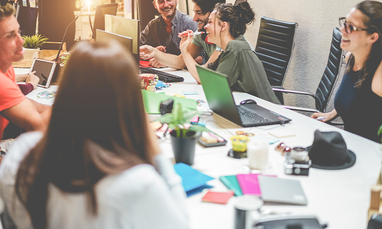 group of people around a table working