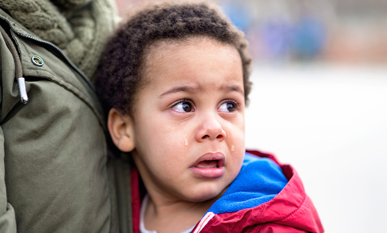 young child with tears on their face